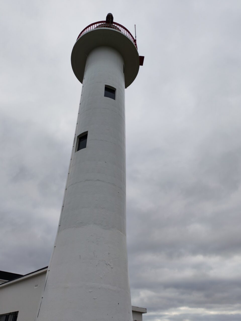The old disused lighthouse in the distance on the east coast
